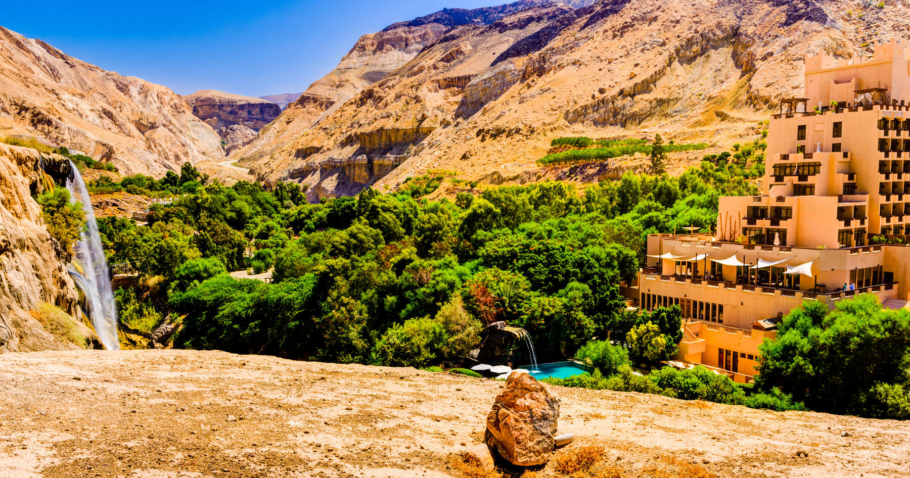 Desert canyon waterfall and resort at Maâ€™in hot springs in Jordan